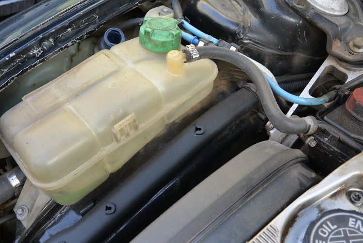 Close up of tank where antifreeze goes in cars.